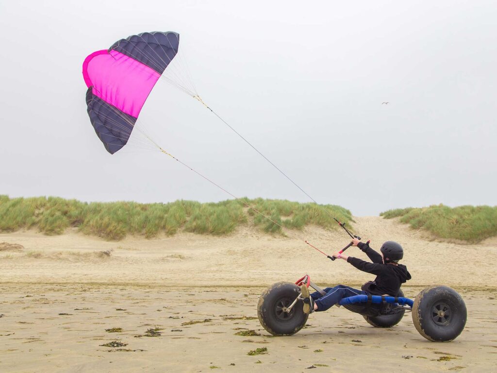 Family friendly things to do like kite buggies on Camber Sands beach