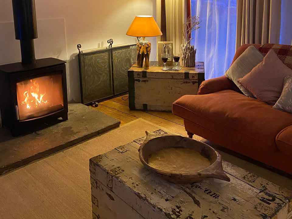 Visit Sussex and sit by the roaring fire in the cosy Barn this winter with a glass of wine. It's bliss.